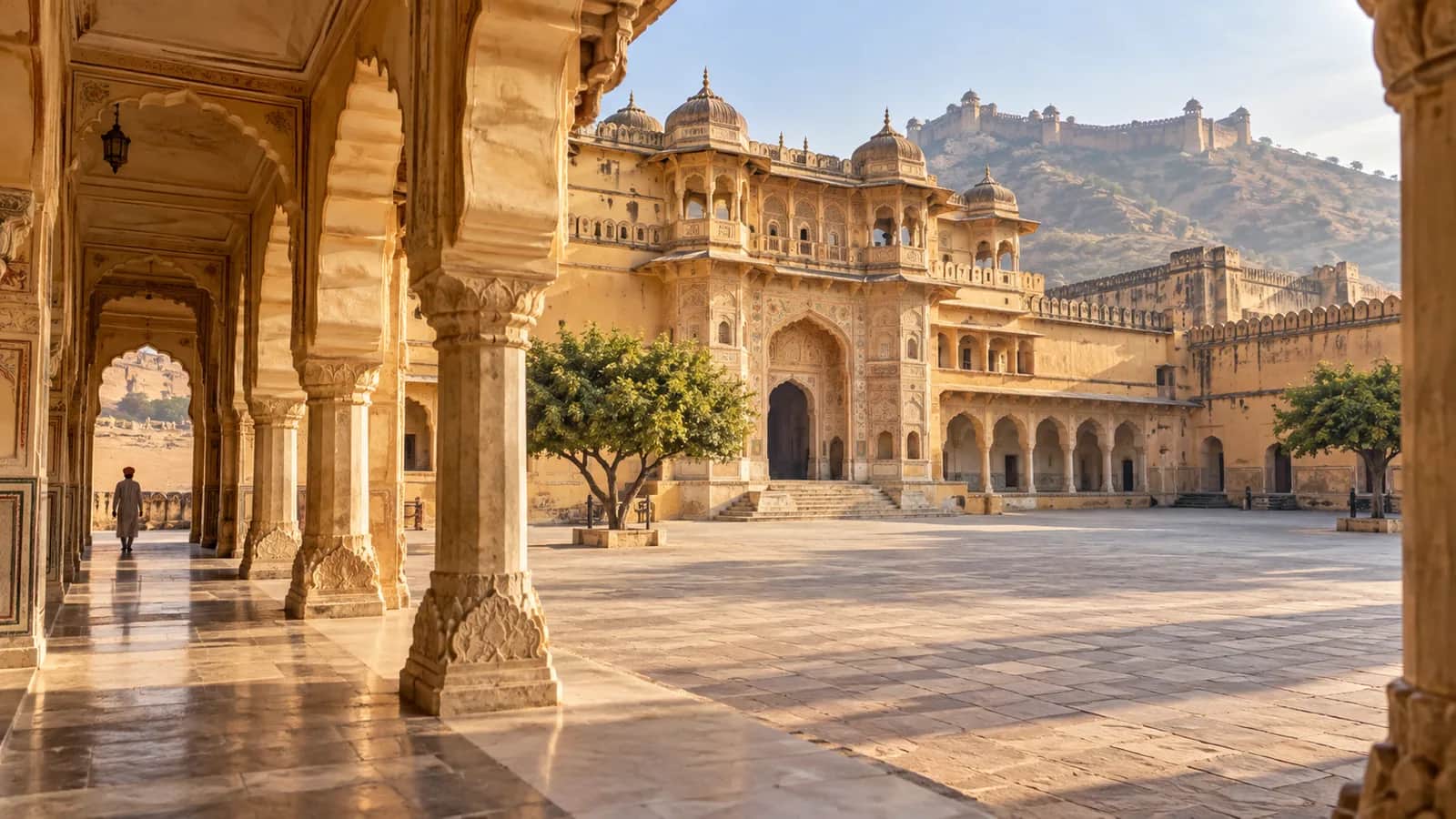 A sunlit arcade opening onto a quiet courtyard at Amer Fort in Jaipur