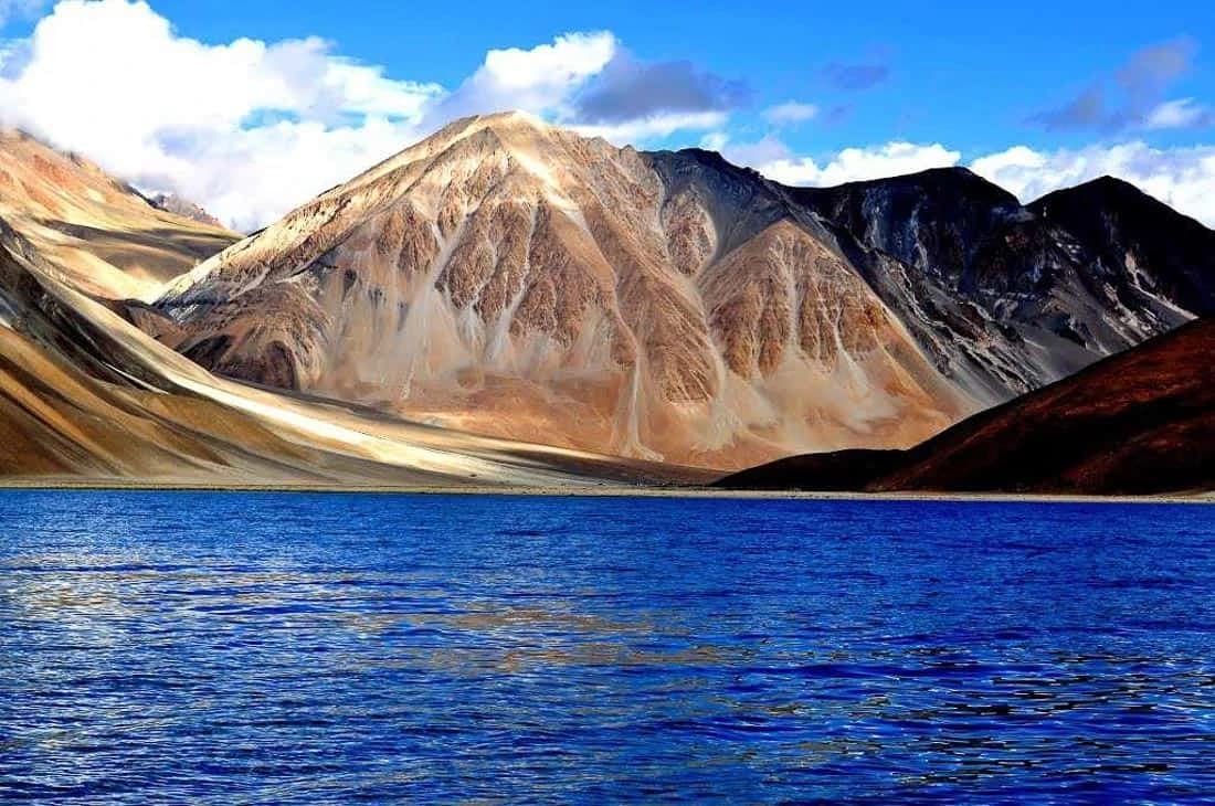 Pangong Lake beneath dramatic mountain peaks in Ladakh