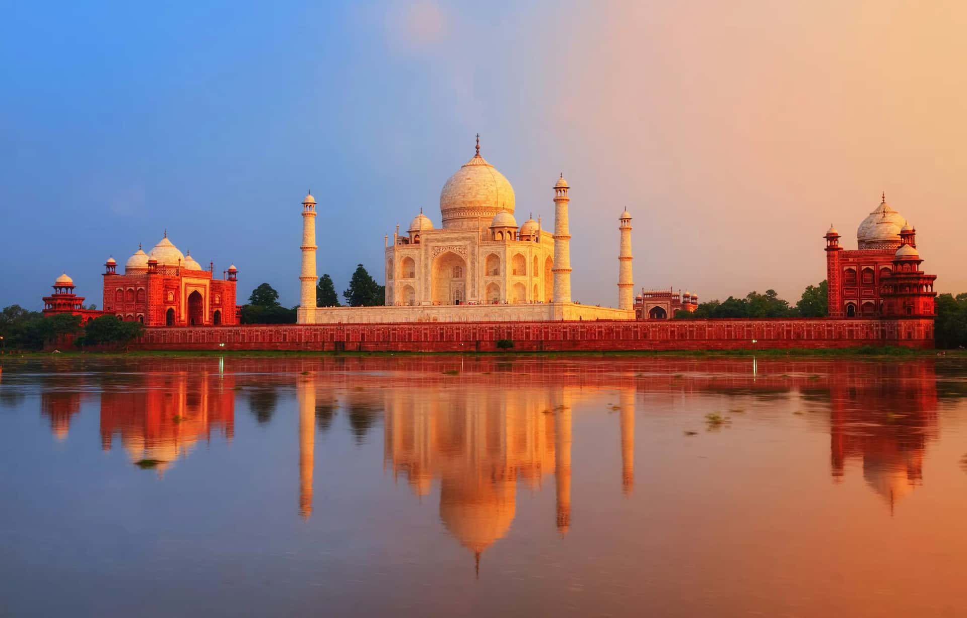 The Taj Mahal glowing above its reflection at dusk