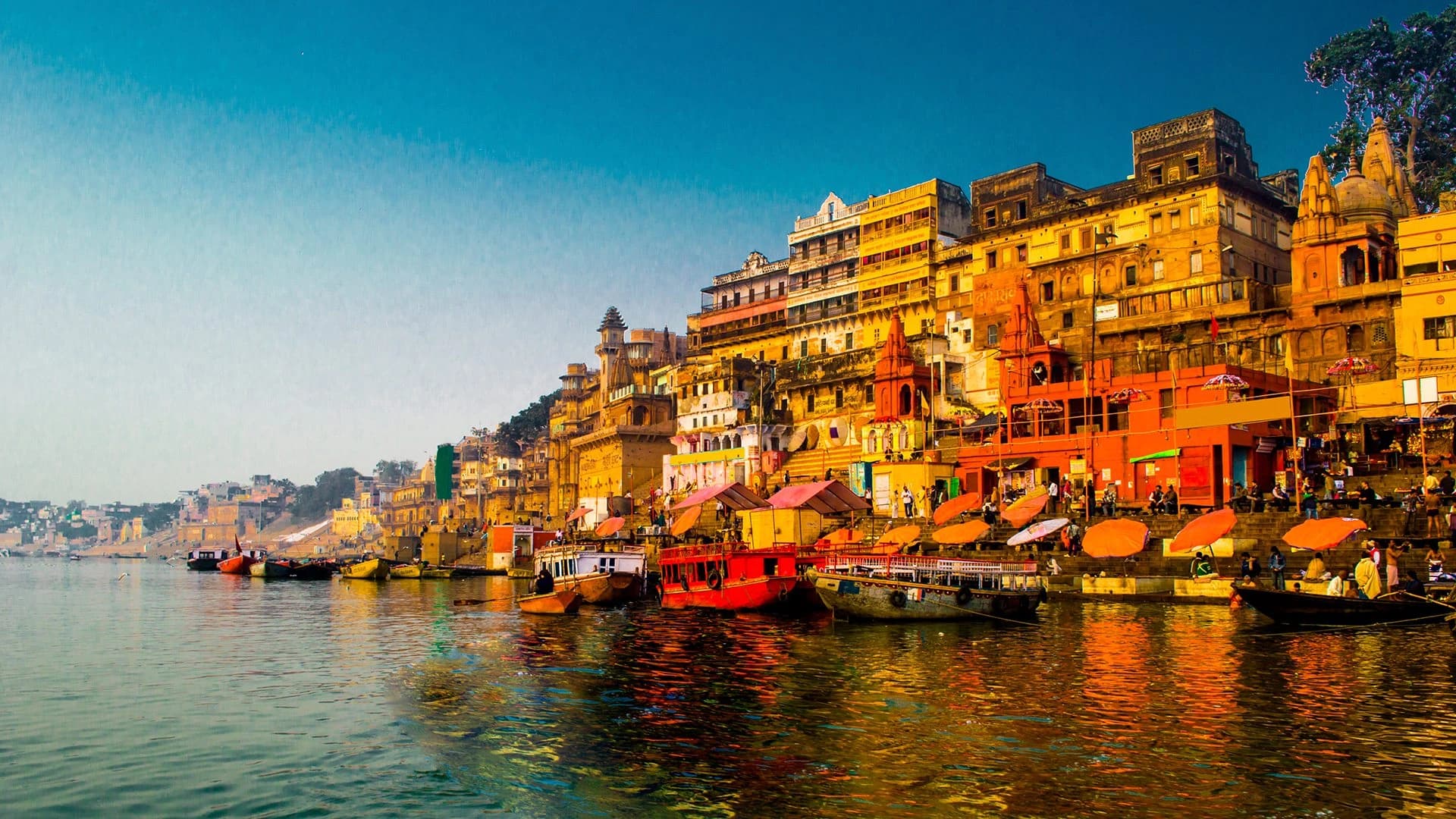 Boats and historic riverfront architecture along the Ganges in Varanasi